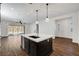 Open kitchen island with stainless steel dishwasher and wood flooring at 395 Nine Mile Creek Dr, Las Vegas, NV 89138