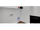 Clean laundry room with hookups and a shelf for storage above at 395 Nine Mile Creek Dr, Las Vegas, NV 89138