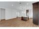 Living room with wood-look floors and a kitchen at 395 Nine Mile Creek Dr, Las Vegas, NV 89138