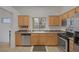 Kitchen with light wood cabinets and stainless steel appliances at 462 Golden State St, Henderson, NV 89012