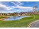 Serene pond with fountain, green grass, and mountain views at 462 Golden State St, Henderson, NV 89012