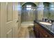 Updated bathroom with granite vanity, shower/tub combo, and tile flooring at 4638 Evan Ridge Ct, Las Vegas, NV 89129
