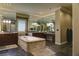 Spa-like bathroom with double vanity and soaking tub at 4638 Evan Ridge Ct, Las Vegas, NV 89129