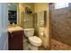 Guest bathroom with toilet, sink, and shower at 4638 Evan Ridge Ct, Las Vegas, NV 89129