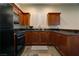 Modern kitchen with granite countertops and dark wood cabinets at 4638 Evan Ridge Ct, Las Vegas, NV 89129