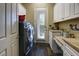 Bright laundry room with washer, dryer, and ample counter space at 4638 Evan Ridge Ct, Las Vegas, NV 89129