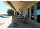 Relaxing covered patio with pool views and outdoor seating at 4638 Evan Ridge Ct, Las Vegas, NV 89129