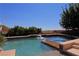 Inviting pool and spa with waterfall feature and ample deck space at 4638 Evan Ridge Ct, Las Vegas, NV 89129