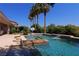 Resort-style pool with spa, waterfall, and basketball court at 4638 Evan Ridge Ct, Las Vegas, NV 89129