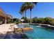 Resort-style pool with spa, waterfall, and basketball court at 4638 Evan Ridge Ct, Las Vegas, NV 89129