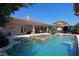Stunning pool and spa with waterfall feature, and a spacious patio at 4638 Evan Ridge Ct, Las Vegas, NV 89129