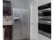 Stainless steel appliances in this kitchen include a double oven and refrigerator at 4929 Shady Rim Ct, Las Vegas, NV 89131