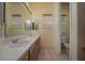 Clean bathroom with double vanity and a separate toilet area at 504 Pinnacle Heights Ln, Las Vegas, NV 89144