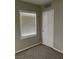 Cozy bedroom featuring neutral walls and carpet and a window for natural lighting at 509 5Th St, Boulder City, NV 89005
