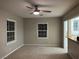 Bright living room featuring a modern ceiling fan, neutral walls and carpet, with great natural light at 509 5Th St, Boulder City, NV 89005