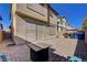 Private backyard patio with brick pavers and firepit at 5648 Ancient Agora St, North Las Vegas, NV 89031
