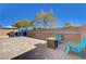 Small backyard with patio, fire pit, and seating at 5648 Ancient Agora St, North Las Vegas, NV 89031