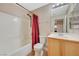 Clean bathroom featuring a tub, toilet and wood vanity at 5648 Ancient Agora St, North Las Vegas, NV 89031
