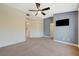 Spacious bedroom with ceiling fan and access to hallway at 5648 Ancient Agora St, North Las Vegas, NV 89031
