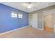 Spacious bedroom with ceiling fan and blue walls at 5648 Ancient Agora St, North Las Vegas, NV 89031