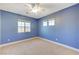 Bedroom with ceiling fan and light blue walls at 5648 Ancient Agora St, North Las Vegas, NV 89031