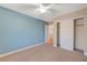 Spacious bedroom with light blue walls and a large closet at 5648 Ancient Agora St, North Las Vegas, NV 89031