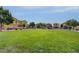 Landscaped green space with townhomes in the background at 5648 Ancient Agora St, North Las Vegas, NV 89031