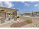 Relaxing community pool with patio tables and chairs, BBQ grills under shaded pergola at 5648 Ancient Agora St, North Las Vegas, NV 89031