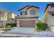 Charming two-story home with a well-manicured lawn, inviting curb appeal, and an attached two-car garage at 5648 Ancient Agora St, North Las Vegas, NV 89031