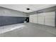 Attached garage with epoxy floor and storage space at 5648 Ancient Agora St, North Las Vegas, NV 89031