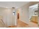 Upstairs hallway with laundry and bathroom access at 5648 Ancient Agora St, North Las Vegas, NV 89031