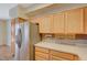 Kitchen features stainless steel appliances and light wood cabinets at 5648 Ancient Agora St, North Las Vegas, NV 89031