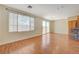 Spacious living room featuring hardwood floors and sliding glass doors at 5648 Ancient Agora St, North Las Vegas, NV 89031