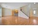 Open living room with hardwood floors, stone fireplace and kitchen views at 5648 Ancient Agora St, North Las Vegas, NV 89031