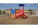 Modern playground with a tube slide and climbing wall at 5648 Ancient Agora St, North Las Vegas, NV 89031