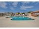 Community pool with surrounding patio and fence at 5648 Ancient Agora St, North Las Vegas, NV 89031