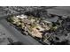 Aerial view of a house on a large lot with surrounding buildings and open space at 5785 W Russell Rd, Las Vegas, NV 89118