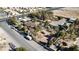 Aerial view of a house on a large lot with surrounding buildings and open space at 5785 W Russell Rd, Las Vegas, NV 89118