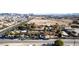 Aerial view of a house on a large lot with city views in the background at 5785 W Russell Rd, Las Vegas, NV 89118