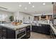 Spacious, updated kitchen featuring marble countertops, stainless steel appliances, and a center island at 5805 Cabo San Lucas Ave, Las Vegas, NV 89131