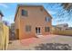 A view of the backyard, which features a brick patio and rock landscaping at 5915 Poplar Tree St, Las Vegas, NV 89148