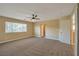 This spacious bedroom features neutral paint, carpet floors, and ample natural light at 5915 Poplar Tree St, Las Vegas, NV 89148