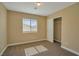 Light-filled bedroom with carpet flooring, a window with blinds, and a closet offering ample storage at 5915 Poplar Tree St, Las Vegas, NV 89148