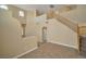 Spacious living area showcasing high ceilings, tile flooring, and staircase with wooden banister at 5915 Poplar Tree St, Las Vegas, NV 89148