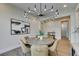 Elegant dining room features a round table and modern chandelier at 6009 Silvalde Ln, Las Vegas, NV 89135