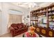 Bright sitting room with comfy couch and decorative shelving at 6781 Southgate St, Pahrump, NV 89061