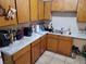 Kitchen with wood cabinets and a double sink at 6941 Appleton Dr, Las Vegas, NV 89156