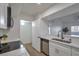 Modern kitchen with white cabinets and stainless steel appliances at 7255 W Sunset Rd # 2130, Las Vegas, NV 89113