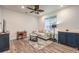 Cozy living room featuring a neutral colored sofa and wood flooring at 804 Aurelie Ridge St, Henderson, NV 89011