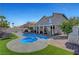 Inviting pool and spa with a scenic backdrop at 8216 Fawn Heather Ct, Las Vegas, NV 89149